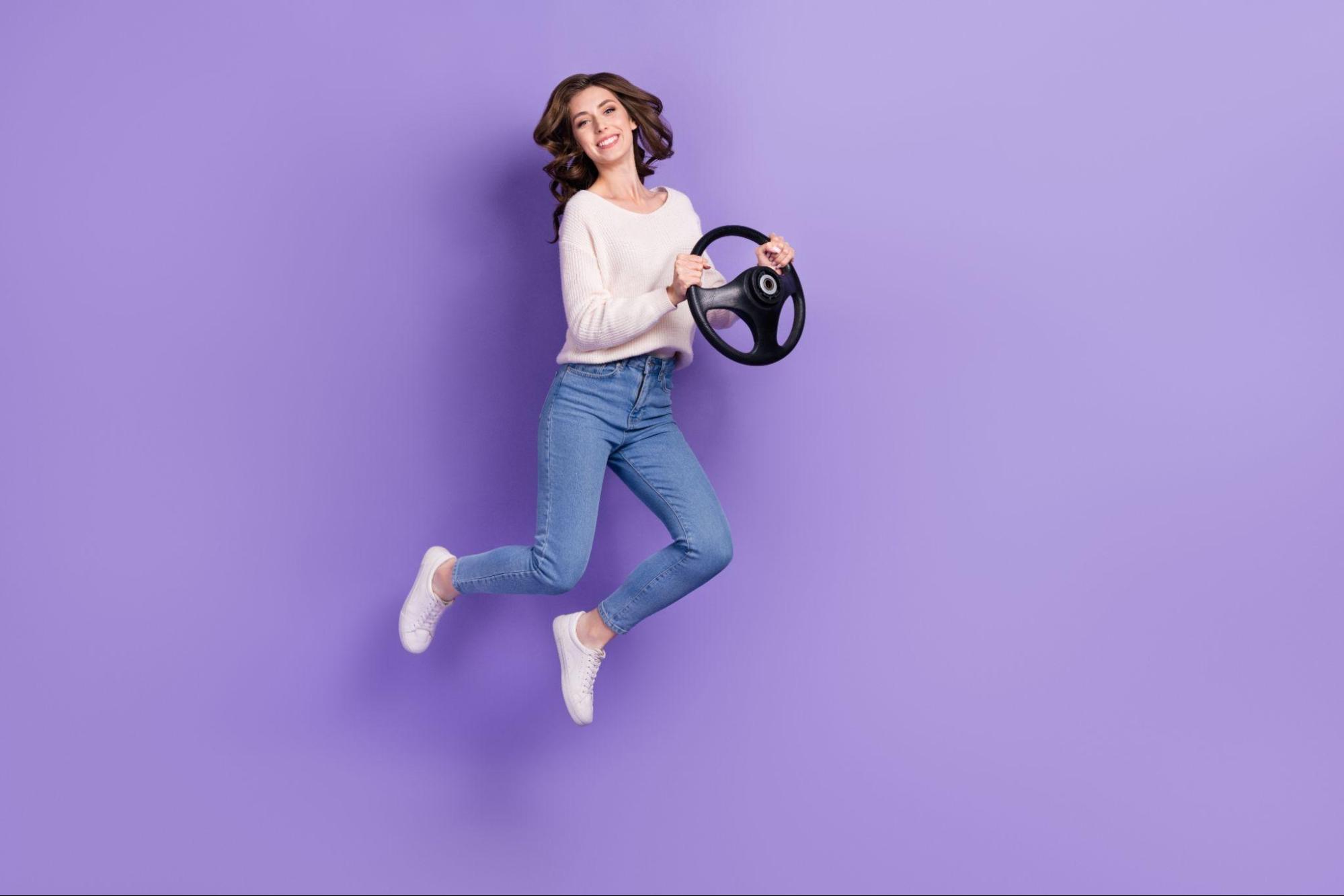 holding steering wheel